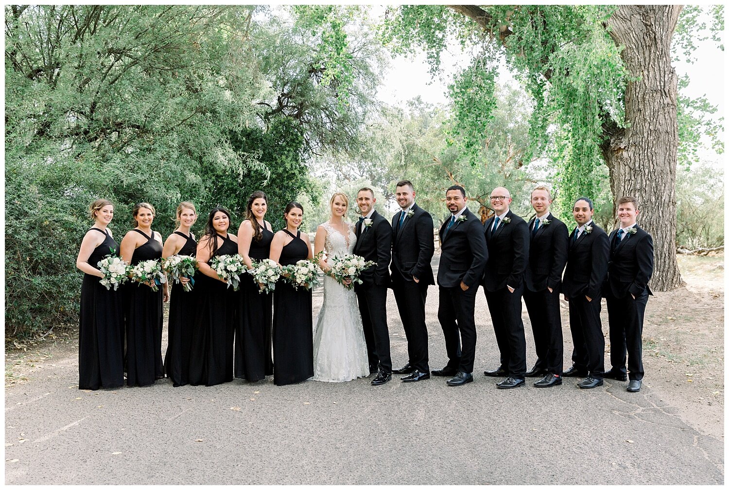La Mariposa Resort Wedding Bridal Party wearing black suits and black dresses for a classic and timeless look.
