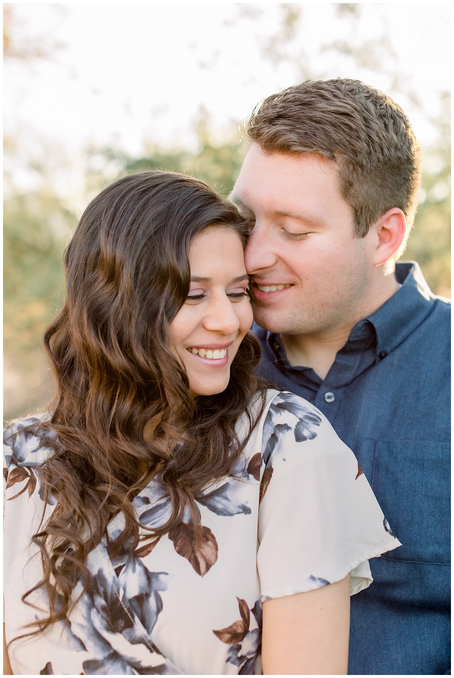 Couple snuggles cheek to cheek during engagement session with Melissa Fritzsche Photography.