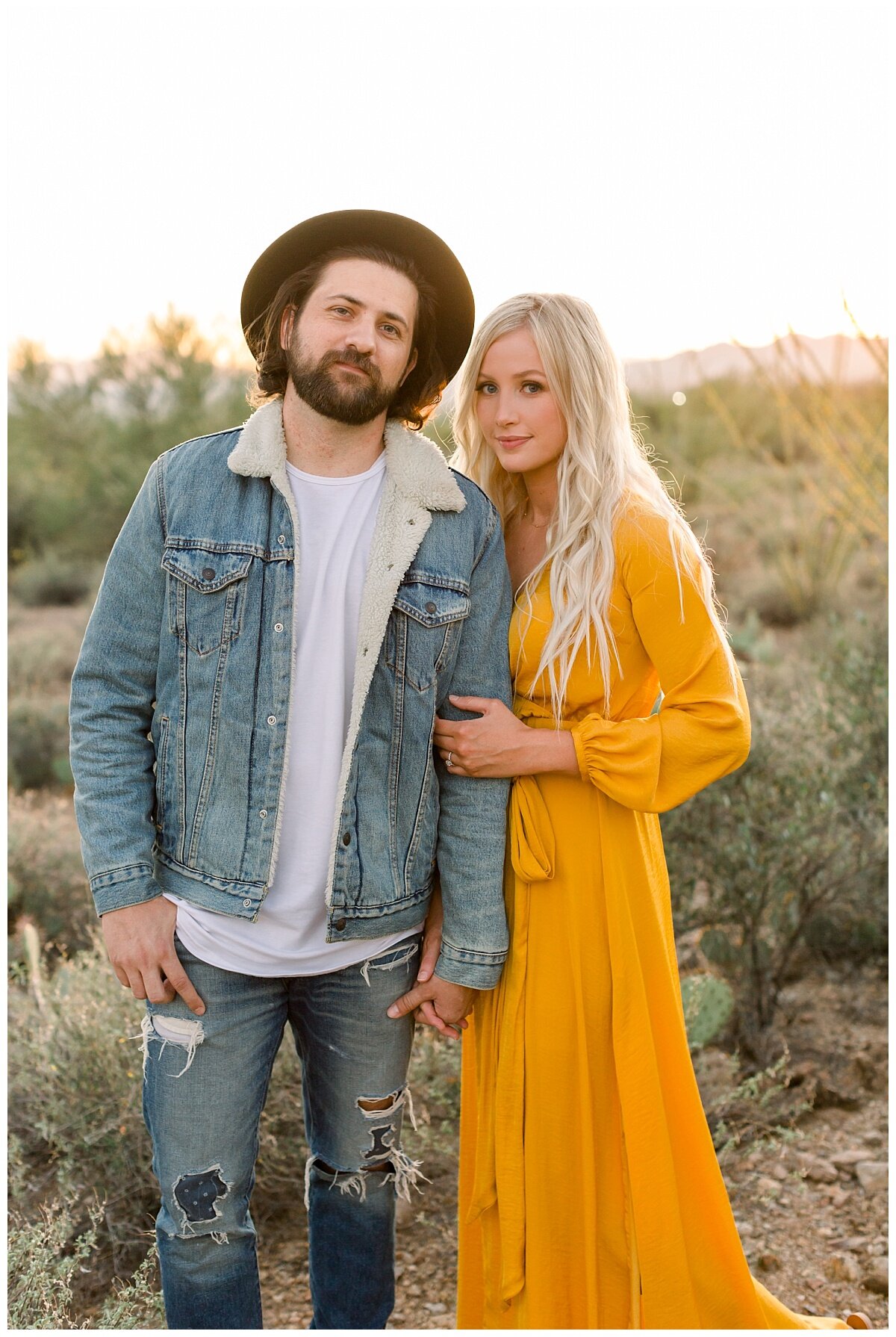 Denim jacket and hat paired with flowy yellow maxi dress for engagement session in Tucson Arizona