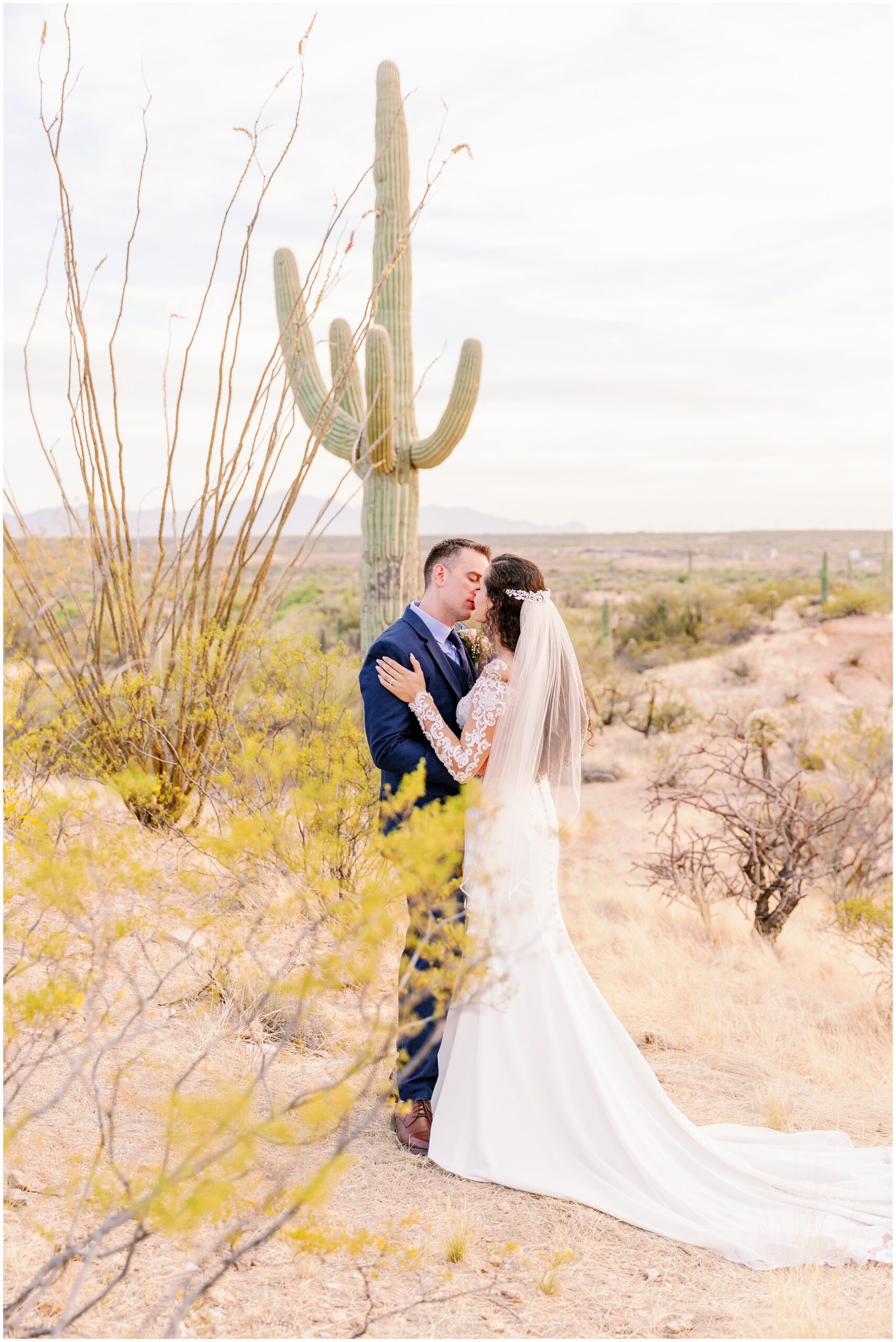 Bride and Groom share a kiss at Saguaro Buttes Wedding Venue in Tucson, Arizona.