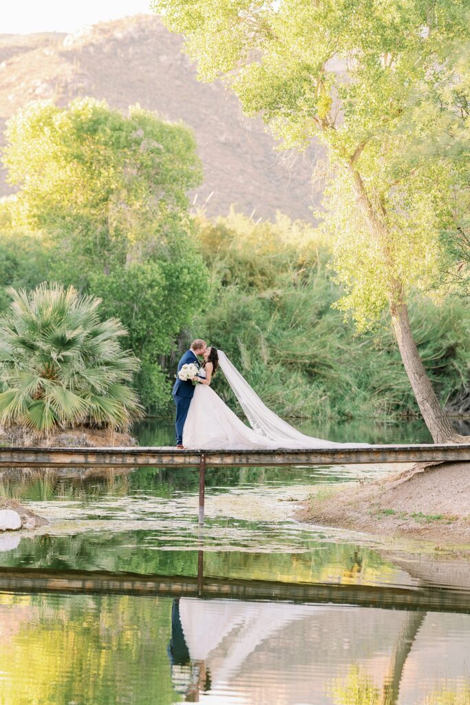 Bride and Groom portraits at the lake at Tanque Verde Ranch Wedding Venue.